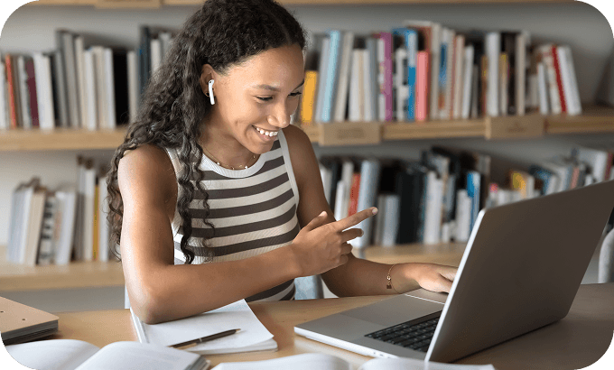 Woman participating in an online tutoring session from her home office, using her laptop